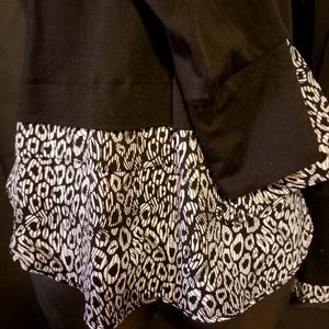 Michael Kors black top with bottom detail.